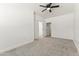 Bedroom with carpet, ceiling fan, white walls and doors with white trim at 5808 W Myrtle Ave, Glendale, AZ 85301