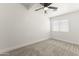 Bedroom with carpet, white walls, ceiling fan and a bright window at 5808 W Myrtle Ave, Glendale, AZ 85301