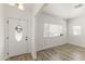 Bright entryway featuring wood-look floors, decorative glass front door, and neutral paint at 5808 W Myrtle Ave, Glendale, AZ 85301