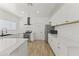Bright kitchen featuring white cabinets, stainless steel appliances, and solid surface countertops at 5808 W Myrtle Ave, Glendale, AZ 85301