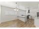 Bright kitchen with white cabinets, stainless steel appliances, and a modern island at 5808 W Myrtle Ave, Glendale, AZ 85301