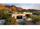 Stunning aerial view of a modern house with views of majestic mountains at 5905 N Echo Canyon Ln, Phoenix, AZ 85018