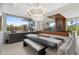 Bright dining room with chandelier, built in seating, and gorgeous backyard views through a large window at 5905 N Echo Canyon Ln, Phoenix, AZ 85018