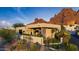 Modern home exterior featuring desert landscaping and striking views of Camelback Mountain at 5905 N Echo Canyon Ln, Phoenix, AZ 85018