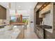 Bright, modern kitchen featuring a marble island, high-end appliances, and an elegant chandelier at 5905 N Echo Canyon Ln, Phoenix, AZ 85018