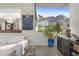 Bright living room with modern artwork, sleek furniture, and stunning mountain views at 5905 N Echo Canyon Ln, Phoenix, AZ 85018