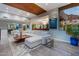 Spacious living area with a large sectional sofa, modern decor, and beautiful views at 5905 N Echo Canyon Ln, Phoenix, AZ 85018