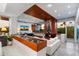 Open-concept living room with a fireplace, fish tank, and large windows offering scenic views at 5905 N Echo Canyon Ln, Phoenix, AZ 85018