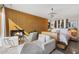An ample bedroom with wood paneled walls, fireplace, seating area and a beautiful crystal chandelier at 5905 N Echo Canyon Ln, Phoenix, AZ 85018