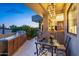 Stylish outdoor dining area featuring built-in grill and elegant lighting at 5905 N Echo Canyon Ln, Phoenix, AZ 85018