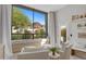 Cozy sitting room featuring comfortable white armchairs and a large window with mountain views at 5905 N Echo Canyon Ln, Phoenix, AZ 85018