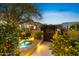 Illuminated water feature and walkway create an inviting evening ambiance at 5905 N Echo Canyon Ln, Phoenix, AZ 85018