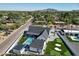 Aerial view showcasing stunning pool, guest house, and putting green in well-manicured backyard at 6126 E Charter Oak Rd, Scottsdale, AZ 85254