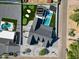 Aerial view of home showcasing a pristine pool, guest house, and putting green at 6126 E Charter Oak Rd, Scottsdale, AZ 85254