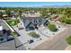 Stunning home with modern exterior, manicured landscaping, and a lush green putting green at 6126 E Charter Oak Rd, Scottsdale, AZ 85254