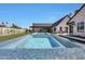Home showcasing a pool and jacuzzi surrounded by green grass and a backyard living space at 6126 E Charter Oak Rd, Scottsdale, AZ 85254
