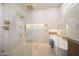 Stylish bathroom with a glass-enclosed shower, a freestanding tub, and modern fixtures at 6126 E Charter Oak Rd, Scottsdale, AZ 85254