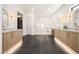 Elegant bathroom featuring dual vanities, a spacious glass-enclosed shower, and modern fixtures at 6126 E Charter Oak Rd, Scottsdale, AZ 85254