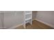 Walk-in closet with custom shelves and hanging rods, maximizing storage space at 6126 E Charter Oak Rd, Scottsdale, AZ 85254