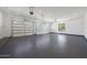Spacious three-car garage with epoxy flooring, natural light, and high ceilings at 6126 E Charter Oak Rd, Scottsdale, AZ 85254