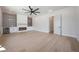 This expansive living room features a modern fireplace, mini bar, and plenty of room at 6126 E Charter Oak Rd, Scottsdale, AZ 85254