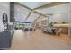 Spacious open concept living area with wood beams, large windows, and modern decor at 6126 E Charter Oak Rd, Scottsdale, AZ 85254