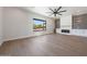 Bright living room with large window, fireplace, modern fixtures, and built in beverage cooler at 6126 E Charter Oak Rd, Scottsdale, AZ 85254