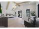 Bright main bedroom featuring vaulted ceilings, exposed beams, and large windows to the backyard at 6126 E Charter Oak Rd, Scottsdale, AZ 85254
