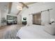 Large main bedroom with sliding barn door to bathroom and large window to backyard at 6126 E Charter Oak Rd, Scottsdale, AZ 85254