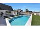 Backyard pool with spa and green grass area in the yard at 6126 E Charter Oak Rd, Scottsdale, AZ 85254