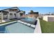Inviting pool and spa area with guest house, bar, and beautifully landscaped yard at 6126 E Charter Oak Rd, Scottsdale, AZ 85254