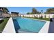 Inviting pool with blue tile, outdoor lounge chairs, and a covered dining area at 6126 E Charter Oak Rd, Scottsdale, AZ 85254