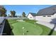 Well-maintained backyard putting green with sand traps at 6126 E Charter Oak Rd, Scottsdale, AZ 85254