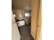 A bathroom featuring a toilet, sink, and shelves at 614 W 12Th St, Casa Grande, AZ 85122