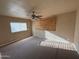 Large bedroom with a ceiling fan and natural light at 614 W 12Th St, Casa Grande, AZ 85122