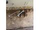 A photo of pipes under a sink reveals water damage and necessary repairs to the floor and wallpaper at 614 W 12Th St, Casa Grande, AZ 85122