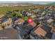 An aerial shot of a residential area, with views of South Mountain and Sierra Estrella, showcases homes and surroundings at 6309 W Hughes Dr, Phoenix, AZ 85043