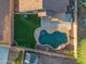 Aerial view of a private backyard with a pool, green lawn, and neatly landscaped areas at 6309 W Hughes Dr, Phoenix, AZ 85043