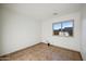 Bright bedroom with a large window overlooking the neighborhood at 6309 W Hughes Dr, Phoenix, AZ 85043