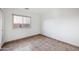 Bright bedroom with neutral walls, tile floors, and a window to let in natural light at 6309 W Hughes Dr, Phoenix, AZ 85043