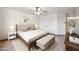 This bedroom features a neutral color palette, a ceiling fan, and plenty of natural light at 6309 W Hughes Dr, Phoenix, AZ 85043
