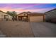Well-kept single-story home featuring a neutral color scheme, desert landscaping, and an attached garage at 6309 W Hughes Dr, Phoenix, AZ 85043