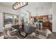 Open-concept kitchen and dining area with stainless steel appliances, wood cabinets, and ample seating at 6309 W Hughes Dr, Phoenix, AZ 85043