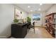 Bright office features a desk, neutral decor, and natural light from the window at 6309 W Hughes Dr, Phoenix, AZ 85043