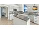 Well-appointed kitchen with granite countertops, stainless steel appliances, and a functional center island at 6713 E Paradise Ln, Scottsdale, AZ 85254