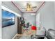 Comfortable office space featuring a ceiling fan, desk, and comfortable seating for a productive workspace at 6713 E Paradise Ln, Scottsdale, AZ 85254