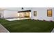 Lush backyard featuring a sparkling pool, a well manicured lawn, and an outdoor entertainment space at 7001 E Joan De Arc Ave, Scottsdale, AZ 85254