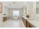 Bathroom features glass-enclosed shower, soaking tub, and dual vanities at 7001 E Joan De Arc Ave, Scottsdale, AZ 85254