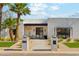 Charming modern home entrance with stylish seating area and beautiful desert landscaping at 7001 E Joan De Arc Ave, Scottsdale, AZ 85254