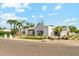 Lovely single story home featuring a manicured lawn and minimalist desert landscaping at 7001 E Joan De Arc Ave, Scottsdale, AZ 85254